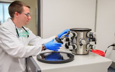Researcher working with lab equipment