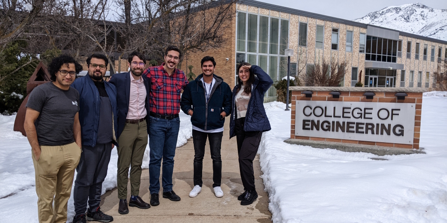 members of the Singleton Transportation Lab standing in front of a College of Engineering sign