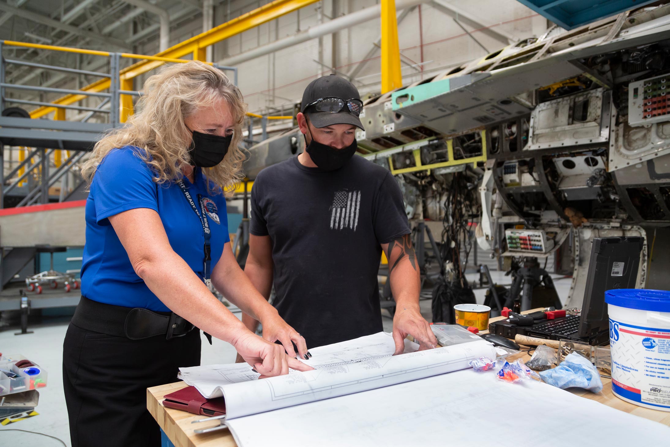 Sandra Fitzgerald works with sheet metal tech Dwain Martinson to refurbish an F-16 at Hill Air Force Base.