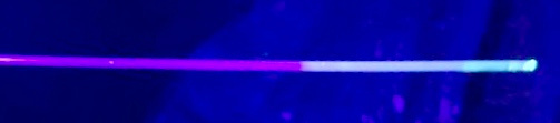 Figure 3: Coated catheter sheath under UV light