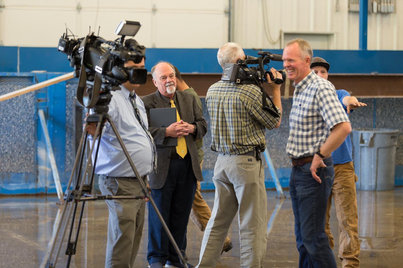 Group of people videoing person